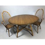 Ercol drop leaf dining table, oval top raised on four splayed square supports with 'X' stretcher,