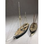 Two modelling sailing ships, the largest approx 43cm in length, the shorter approx 37cm (A/F)