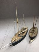 Two modelling sailing ships, the largest approx 43cm in length, the shorter approx 37cm (A/F)