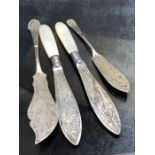 Four Silver Sheffield hallmarked Silver Knives two with pearl handles (total weight 94g)