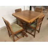 Light oak extending table with four matching chairs of Mid Century style