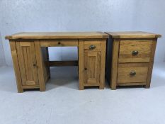 Modern oak computer desk, approx 129cm x 55cm x 79cm tall and a two drawer oak filing cabinet,