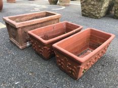 Three square terracotta planters, the largest approx 41cm x 22cm x 20cm tall