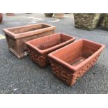 Three square terracotta planters, the largest approx 41cm x 22cm x 20cm tall