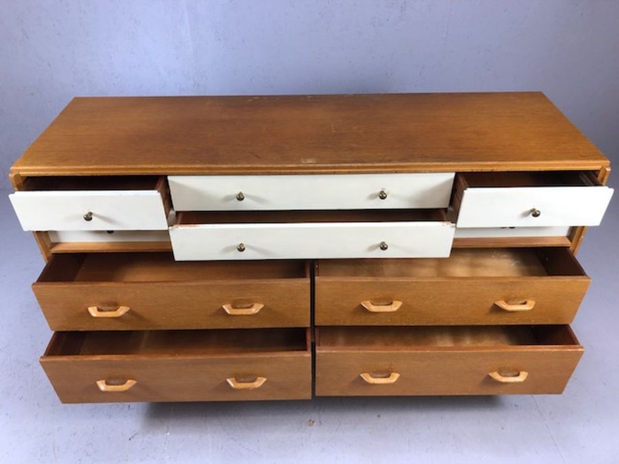 G-Plan Mid Century sideboard of ten drawers on black lacquered feet with brass detailing, six - Image 3 of 9