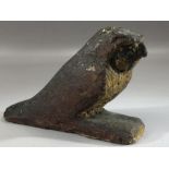 Small carved wooden falcon, possibly Egyptian, with remnants of painted design particularly to