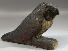 Small carved wooden falcon, possibly Egyptian, with remnants of painted design particularly to