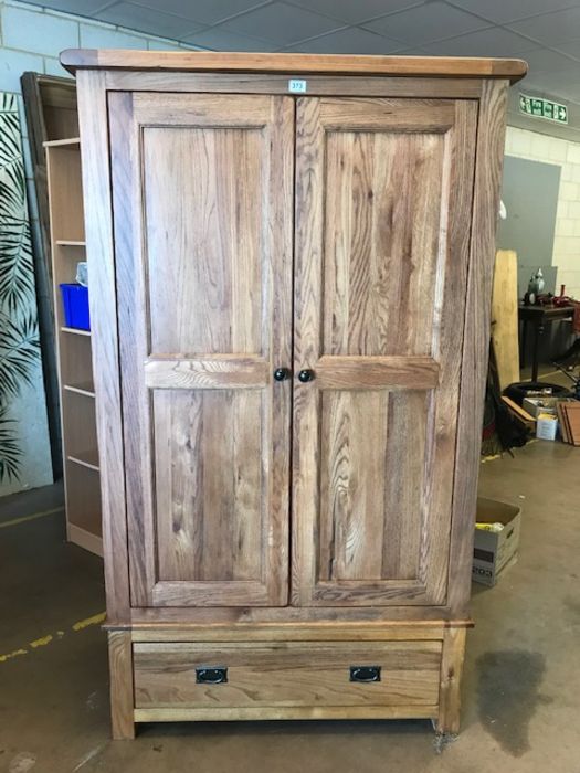 Modern oak two door wardrobe with hanging rail and drawer under, approx 106cm x 55cm x 192cm tall