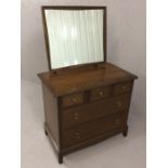 Small Stag dressing table with glass top, mirror over and five drawers under, approx 82cm x 46cm x
