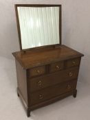 Small Stag dressing table with glass top, mirror over and five drawers under, approx 82cm x 46cm x