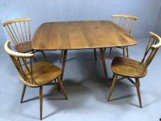 Blond Ercol drop leaf dining room table and four blond stick back chairs (pair of straight stick