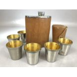 Set of six stirrup cups by maker CROSS in leather pouch and a leather wrapped Hip Flask