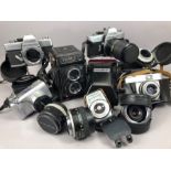 Collection of vintage cameras and lenses to include a Yashica Mat-124 G, Minolta SR T 101 x 2,