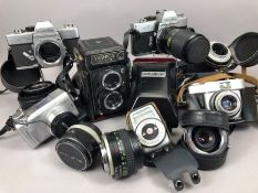 Collection of vintage cameras and lenses to include a Yashica Mat-124 G, Minolta SR T 101 x 2,