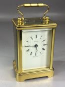 Carriage clock by Henley, white enamel dial with Roman numerals and makers name, the brass five