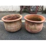 Pair of circular rib design terracotta planters, approx 35cm in diameter