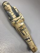 Wooden shabti with black painted detailing to face and body, approx 16.5 cm in length, losses can be