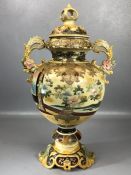 Large Japanese Satsuma twin handled urn with ornate lid and all-over decoration depicting warriors