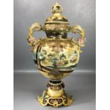 Large Japanese Satsuma twin handled urn with ornate lid and all-over decoration depicting warriors