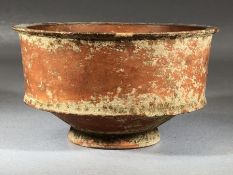 Small vessel, possibly Roman terra sigilatta, on single low food, approx 10cm in diameter x 6cm in