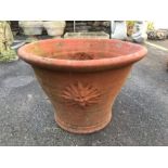 Terracotta fluted rim planter with sunburst design, approx 46cm in diameter