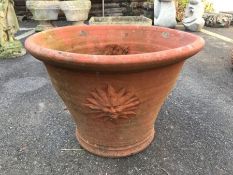 Terracotta fluted rim planter with sunburst design, approx 46cm in diameter