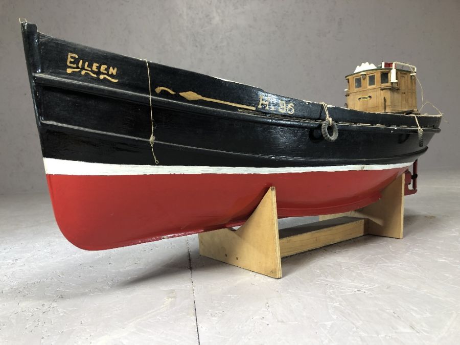 Scale wooden model of the fishing boat 'Eileen', on cradled stand, approx 75cm in length (A/F)