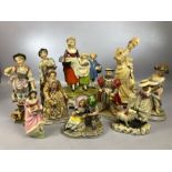 Collection of ceramic figurines to include a lady holding a dog signed B. Merli, a Staffordshire