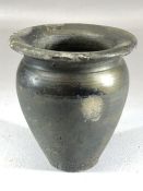 Small Roman vase or pot with black colouring, flared neck on a narrow base, signs of repair,