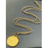 Gold Sovereign dated 1915 on a 9ct Gold fine link chain (total weight 12.5g)