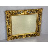 Ornate gilt wood framed oblong mirror, approx 70cm x 81cm