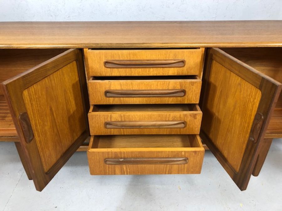 Mid Century red label G-Plan sideboard with cupboards either side and drawers to centre, raised on - Image 3 of 8