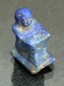 Lapis Lazuli miniature block statue or amulet depicting a man squatting with his knees drawn up to