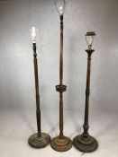 Three wooden turned and carved standard lamps, the tallest approx 172cm