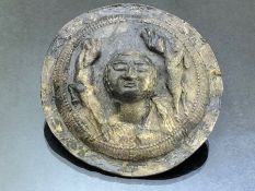 Soft metal, possibly early silver, phalera or sculpted disc/plaque with embossed head to centre