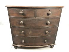 Bow fronted chest of five drawers on turned feet
