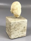 Alabaster head of a woman, possibly Goddess, mounted on a marble plinth, approx 5cm in height (