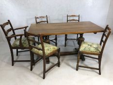 Oak dining table with heavily carved baluster legs and cross stretcher, with one carver and four