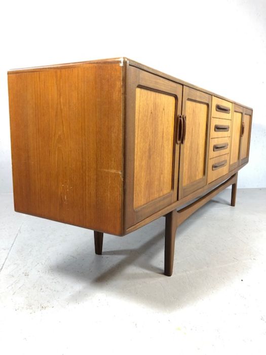 Mid Century red label G-Plan sideboard with cupboards either side and drawers to centre, raised on - Image 7 of 8