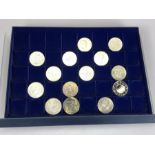 Collection of fourteen commemorative and collectable coins in presentation case