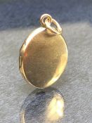 14k Gold Locket approx 17mm tall and 3.4g