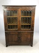 Oak linen fold book case with leaded and glazed doors, cupboard under, approx 99cm x 33cm x 135cm