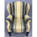 Modern wingback armchair in cream and blue upholstery