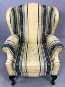 Modern wingback armchair in cream and blue upholstery