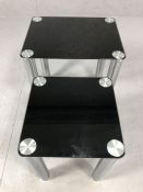 Modern black glass and chrome nest of two tables, largest approx 45cm x 35cm x 50cm tall