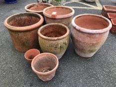 Collection of seven terracotta garden planters