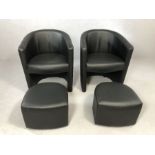 Pair of modern black tub chairs with pull-out foot stools