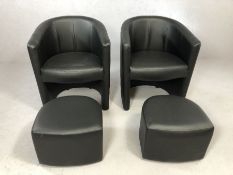 Pair of modern black tub chairs with pull-out foot stools