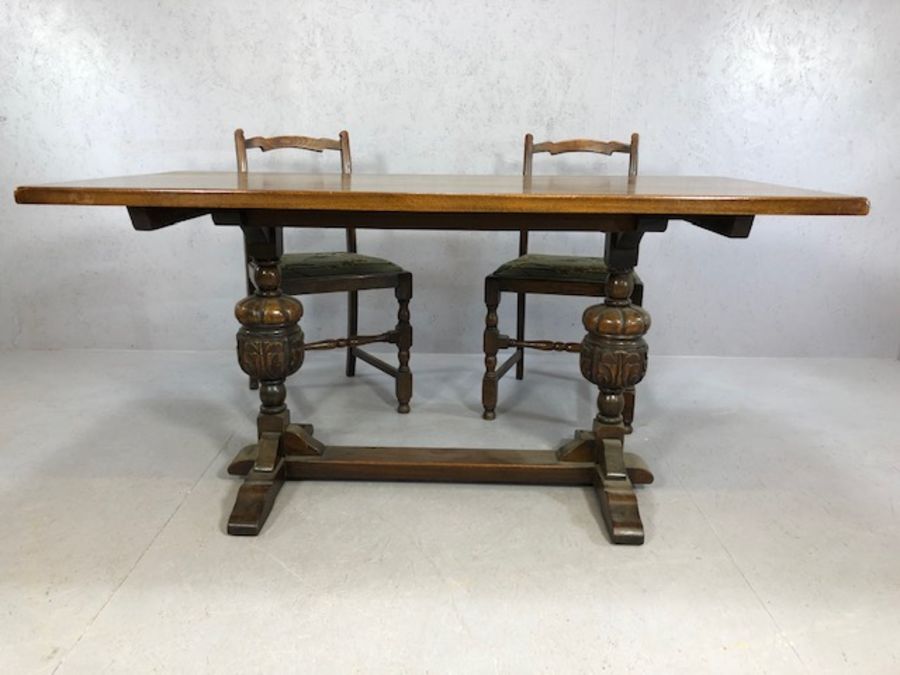 Oak dining table with heavily carved baluster legs and cross stretcher, with one carver and four - Image 4 of 5