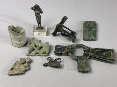 Collection of artefacts, mostly appearing to be Roman, to include bronze gladiator brooch, lead